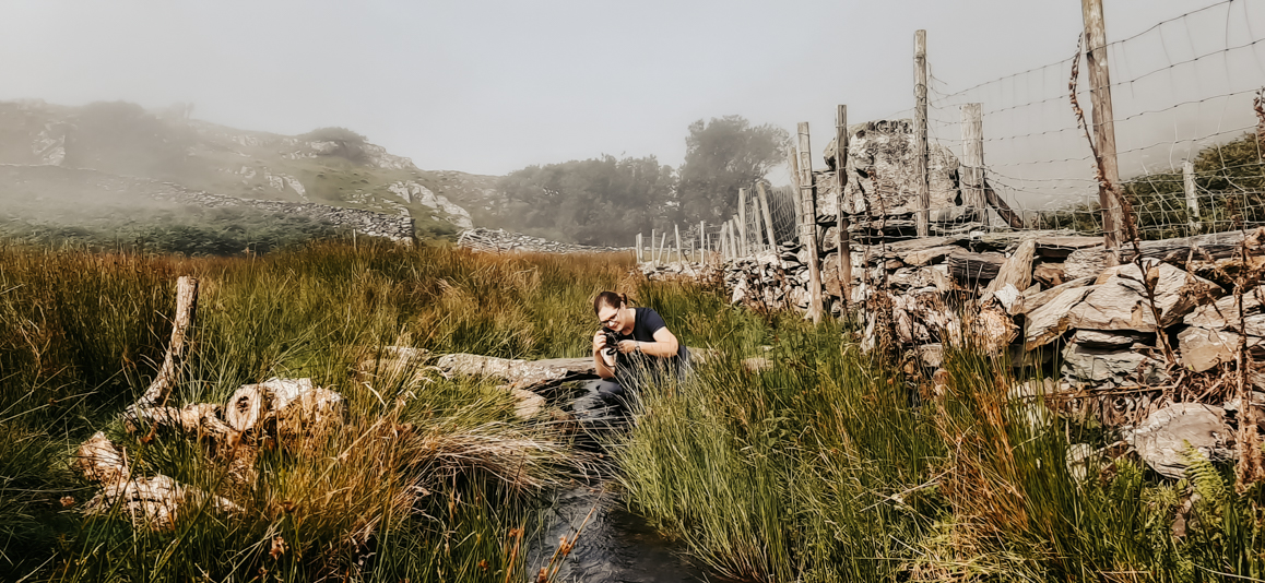 Emma Duder in a stream